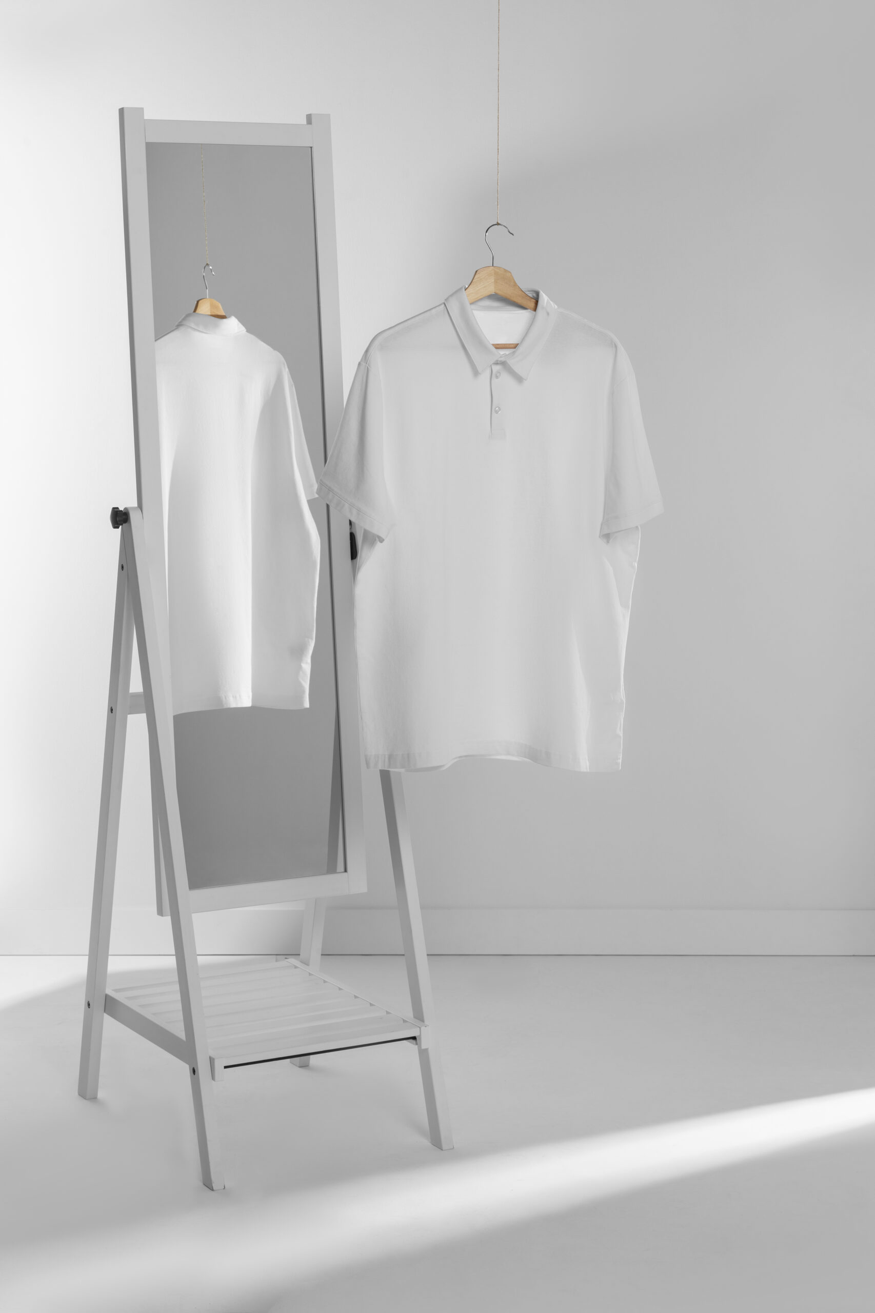 clean-blank-shirt-hanger-by-mirror